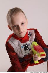 DENISA SITTING POSE WITH GUN